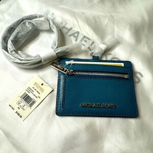 MK blue chrome card case with strap MSRP$168